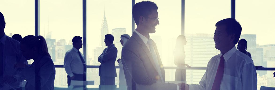 Two businessmen embracing
