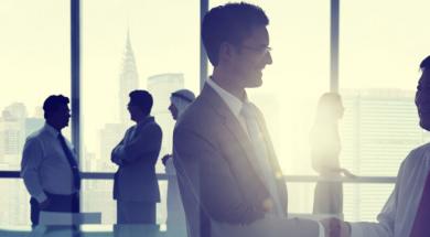 Two businessmen embracing